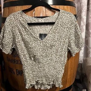 Cute blouse that has never been worn with the tags still on it.